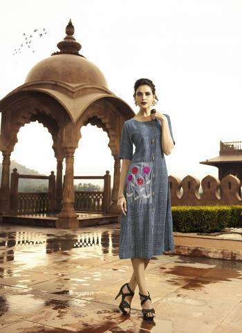 Add This Readymade Kurti To Your Wardrobe In Blue & Grey Color Fabricated On Rayon. It Is Beautified With Checks Prints And Floral Thread Work. 