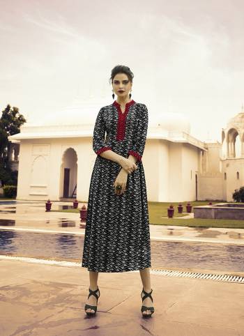 Here Is A Rich Looking Designer Readymade Printed Kurti In Black & Grey Color. This Pretty Kurti Is Fabricated On Rayon And You Can Pair This Up With Leggings, Pants Or Plazzo. 