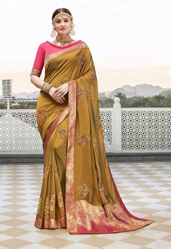 Attract All Wearing This Designer Saree In Musturd Yellow Color Paired With Contrasting Pink Colored Blouse. This Saree Is Fabricated On Satin Silk Paired With Art Silk Fabricated Blouse. It Is Beautified With Embroidered Motifs And Lace Border. 