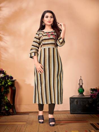 Here Is A Very Pretty Designer Readymade Kurti In Brown & Grey Color Fabricated On Cotton. It Is Beautified With Striped Prints And Thread Work. 