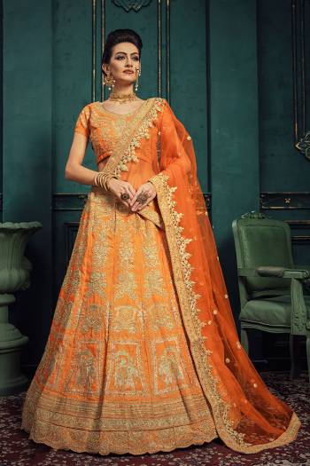 Shine Bright Wearing This Heavy Designer Lehenga Choli In All Over Orange Color. Its Heavy Embroidered Blouse And Lehenga Are Art Silk Based Paired With Net Fabricated Embroidered Dupatta. 