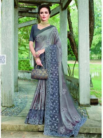 Opt for This Rich and elegant Looking Heavy Designer Saree In Grey Color. Also It Is Beautified With Tone To Tone Embroidery Which Gives A Real Subtle Look. 