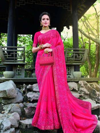 Add This Beautiful Heavy Designer Saree To Your Wardrobe In Dark Pink Color For The Upcoming Wedding And Festive Season. This Pretty Saree Is Beautified With Lovely Embroidery Giving An Attractive Look.