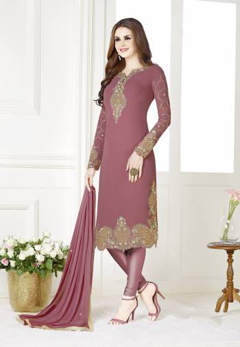 Add This Beautiful Designer Straight Suit To Your Wardrobe In Dusty Pink Color. Its Top Is Fabricated On Georgette Paired With Santoon Bottom And Chiffon Dupatta. Its Fabric Is Light In Weight And Easy To Carry All Day Long