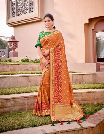 An excellent combination of Indian saffron and fresh green , this saree is the essence of the Indian culture. Wear it in any Indian drape , you are bound to look beautiful.