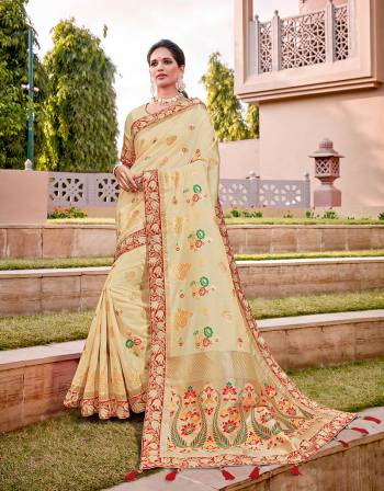 Emanate an aesthetically pleasing vibe in thi feminine and rich cream-and-red saree with subtle weaves.. Drape in a classic falling pallu style to look ethereal. 