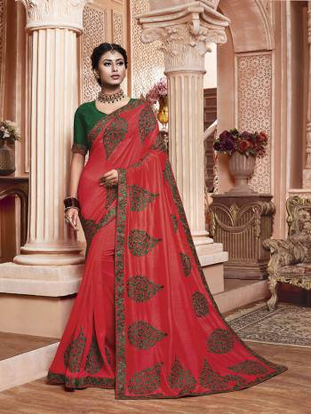 Get Ready For The Upcoming Wedding And Festive Season With This Designer Saree In Dark Pink Color Paired With Contrasting Green Colored Blouse. This Contrasting Embroidered Saree Is Fabricated On Vichitra Silk Paired With Art Silk Fabricated Blouse.