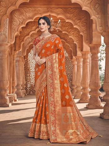 Celebrate This Festive And Wedding Season With This Heavy Designer Saree In Rust Orange Which Comes With Two Designer Blouses, One Simple Plain Blouse And Another Designer Embroidered Blouse. This Pretty Saree Is Fabricated On Jacquard Silk Paired With Art Silk Fabricated Blouses.