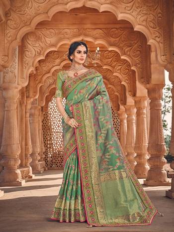 Here Is A Very Pretty Heavy Designer Saree Which Comes With Two Blouses. This Beautiful Light Green Colored Heavy Embroidered Saree Is Fabricated On Jacquard Silk Paired With A Plain Art Silk Blouse And Another Embroidered Art Silk Fabricated Blouse. Buy This Pretty Saree Now.