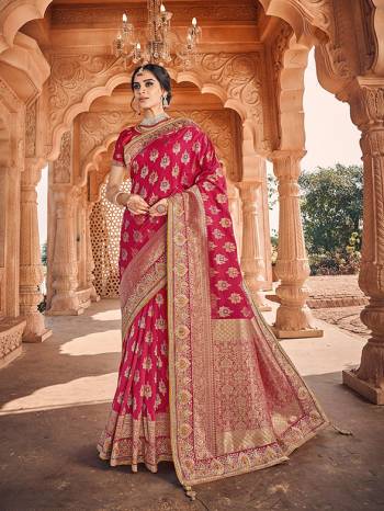 Celebrate This Festive And Wedding Season With This Heavy Designer Saree In Dark Pink Which Comes With Two Designer Blouses, One Simple Plain Blouse And Another Designer Embroidered Blouse. This Pretty Saree Is Fabricated On Jacquard Silk Paired With Art Silk Fabricated Blouses.