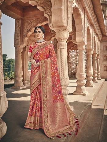 Here Is A Very Pretty Heavy Designer Saree Which Comes With Two Blouses. This Beautiful Dark Orange Colored Heavy Embroidered Saree Is Fabricated On Jacquard Silk Paired With A Plain Art Silk Blouse And Another Embroidered Art Silk Fabricated Blouse. Buy This Pretty Saree Now.