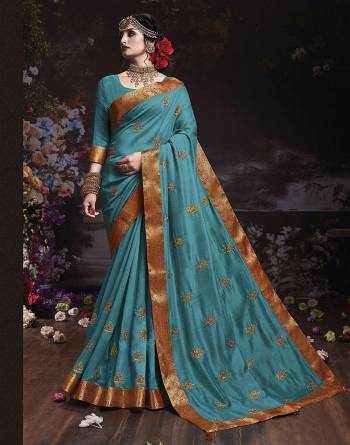 Get Ready For The Upcoming Wedding And Festive Season With This Designer Saree In Blue Color. This Attractive Jari Embroidered Saree Is Fabricated On Vichitra Silk Paired With Vichitra Silk Fabricated Blouse. It Is Beautified With Broad Lace Border With Stone Work. Buy Now.