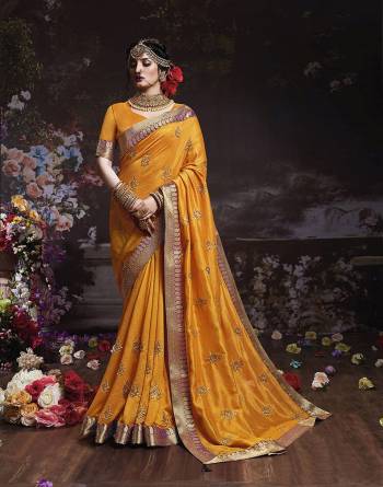 Get Ready For The Upcoming Wedding And Festive Season With This Designer Saree In Musturd Yellow Color. This Attractive Jari Embroidered Saree Is Fabricated On Vichitra Silk Paired With Vichitra Silk Fabricated Blouse. It Is Beautified With Broad Lace Border With Stone Work. Buy Now.