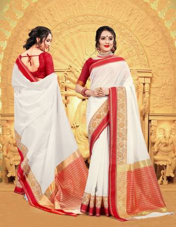 Celebrate This Festive Season Wearing This Pretty elegant Looking Saree In White And Red Color Paired With A Lovely Red Colored Blouse. This Saree And Blouse Are Khadi Silk Based Which Also Gives a Rich And Elegant Look To Your Personality.