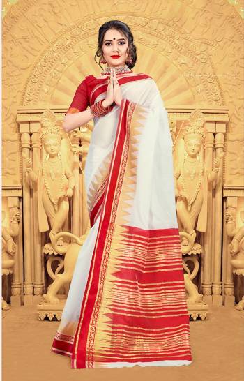 Celebrate This Festive Season Wearing This Pretty elegant Looking Saree In White And Red Color Paired With A Lovely Red Colored Blouse. This Saree And Blouse Are Khadi Silk Based Which Also Gives a Rich And Elegant Look To Your Personality.