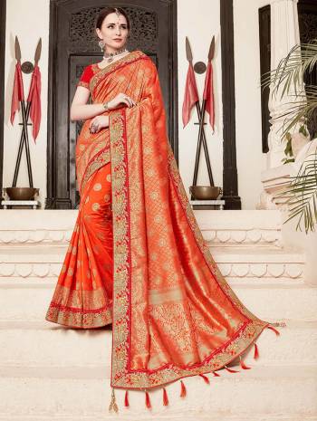 For A Proper Traditional Look, Grab This Heavy Designer Saree In Orange Color Paired With Contrasting Red Colored Blouse. This Saree Is Fabricated On Jacquard Silk Paired With Art Silk Fabricated Blouse. It Is Beautified With Heavy Embroidered Lace Border And Blouse. 