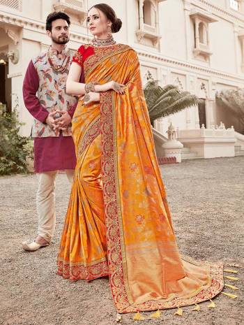 For A Proper Traditional Look, Grab This Heavy Designer Saree In Musturd Yellow Color Paired With Contrasting Red Colored Blouse. This Saree Is Fabricated On Jacquard Silk Paired With Art Silk Fabricated Blouse. It Is Beautified With Heavy Embroidered Lace Border And Blouse. 