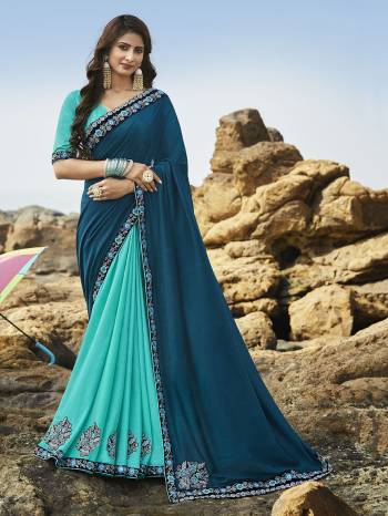 Go With The Pretty Shades Of Blue With This Blue And Turquoise Blue Colored Saree Paired With Turquoise Blue Colored Blouse. This Saree Is Fabricated Rich Soft Art Silk Beautified With Attractive Detailed Embroidery. Buy This Saree Now.