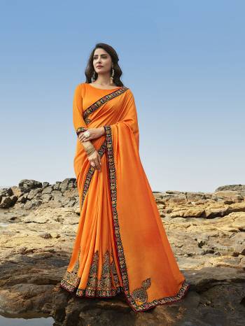 Celebrate this Festive Season Wearing This Attractive Heavy Designer Saree In Orange Color Paired With Orange Colored Blouse. This Saree Is Soft Silk Based Which Gives A Rich Look To Your Personality.  