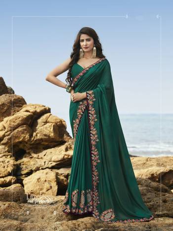 New Shade Is Here To Add Into Your Wardrobe With This Heavy Designer Saree In Teal Green Color Paired With Teal Green Colored Blouse. This Saree And Blouse Are Rich Silk Based, It Rich Fabric And Unique Color Will Definitely Earn Ypu Lots Of Compliments From Onlookers. 