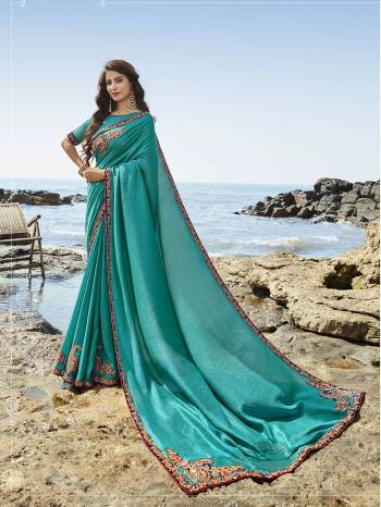 New Shade Is Here To Add Into Your Wardrobe With This Heavy Designer Saree In Turquoise Blue Color Paired With Turquoise Blue Colored Blouse. This Saree And Blouse Are Rich Silk Based, It Rich Fabric And Unique Color Will Definitely Earn Ypu Lots Of Compliments From Onlookers. 