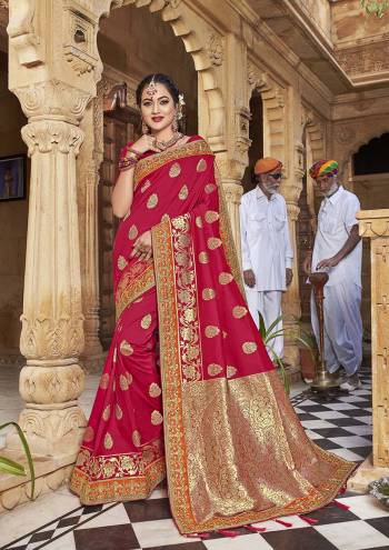 Celebrate This Festive In This Rich And Elegant Looking Silk Based Designer Saree In Dark Pink Color Paired With Red Colored Blouse. This Saree Is Fabricated On Satin Jacquard Silk Paired With Art Silk Fabricated Blouse. Its Rich Fabric And Color Will Earn You Lots Of Compliments From Onlookers.