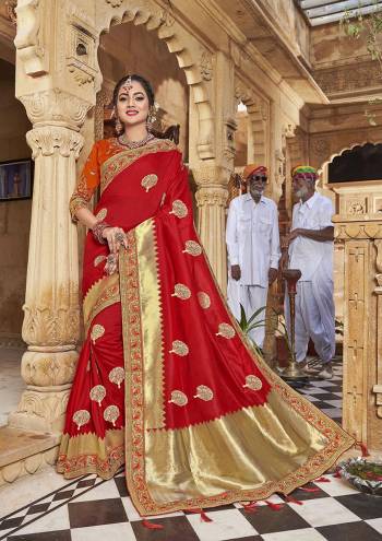 Celebrate This Festive In This Rich And Elegant Looking Silk Based Designer Saree In Red Color Paired With Orange Colored Blouse. This Saree Is Fabricated On Satin Jacquard Silk Paired With Art Silk Fabricated Blouse. Its Rich Fabric And Color Will Earn You Lots Of Compliments From Onlookers.