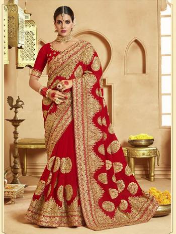 Here Is A Very Attractive Heavy Designer Bridal Saree For The Upcoming Wedding Season In Red Color Paired With Embroidered Red Colored Blouse. It Is Beautified With Heavy Jari Embroidery With Stone Work. Buy This Lovely Bridal Saree Now.