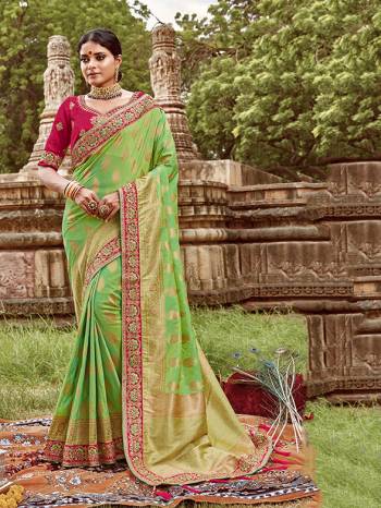 Here Is A Very Pretty Heavy Designer Saree. This Beautiful Light Green Colored Heavy Embroidered Saree Is Fabricated On Jacquard Silk Paired With An Embroidered Dark Pink Colored Art Silk Fabricated Blouse. Buy This Pretty Saree Now.