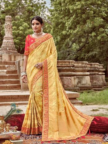 Here Is A Very Pretty Heavy Designer Saree. This Beautiful Light Yellow Colored Heavy Embroidered Saree Is Fabricated On Jacquard Silk Paired With An Embroidered Dark Peach Colored Art Silk Fabricated Blouse. Buy This Pretty Saree Now.