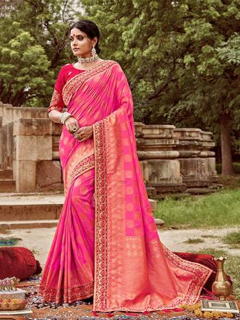 Celebrate This Festive And Wedding Season With This Heavy Designer Saree In Pink Color Paired With Dark Pink Colored Blouse. This Pretty Saree Is Fabricated On Jacquard Silk Paired With Art Silk Fabricated Blouse.