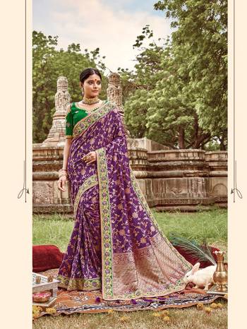 Here Is A Very Pretty Heavy Designer Saree. This Beautiful Purple Colored Heavy Embroidered Saree Is Fabricated On Jacquard Silk Paired With An Embroidered Green Colored Art Silk Fabricated Blouse. Buy This Pretty Saree Now.