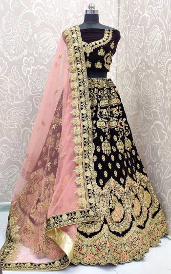 Look Pretty In This Trending Color For Bridal Wear?In Dark Purple Color Paired With Contrasting Baby Pink Colored Dupatta. This Very Beautiful Heavy Designer Lehenga Choli Is Fabricated on Velvet Paired With Net Fabricated Dupatta. Buy Now. Its Attractive Embroidery And Color Will Definitlely Earn You Lots Of Compliments From Onlookers.