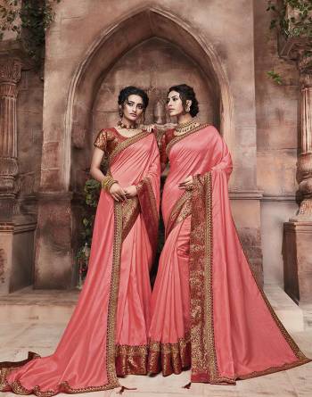 Grab This Pretty Attractive Saree In Dark Peach Color Paired With?Contrasting Red Colored Blouse. This Saree Is Fabricated On Soft Art Silk Paired With Brocade Fabricated Blouse. Its Rich Fabric And Color Will Earn You Lots Of Compliments From Onlookers.?