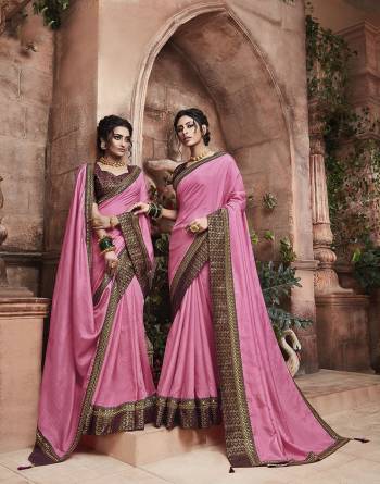 Grab This Pretty Attractive Saree In Pink Color Paired With?Contrasting Wine Colored Blouse. This Saree Is Fabricated On Soft Art Silk Paired With Brocade Fabricated Blouse. Its Rich Fabric And Color Will Earn You Lots Of Compliments From Onlookers.?