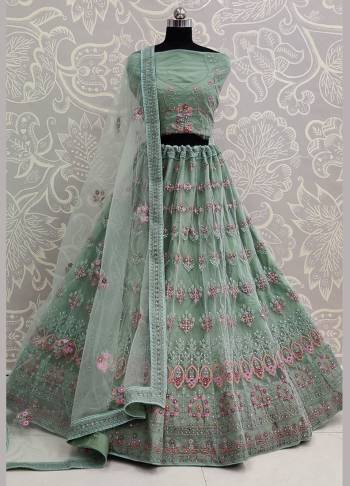 Here Is A Very Pretty Heavy Designer Lehenga Choli For The Bridesmaid In This Lovely Pastel Green Color. This Detailed Embroidered Lehenga Choli And Dupatta Are Fabricated On Net Which Is Light Weight, Durable And Gives A Pretty Look The Personality. Buy This Pretty Piece Now.