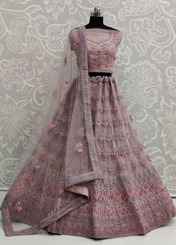 Here Is A Very Pretty Heavy Designer Lehenga Choli For The Bridesmaid In This Lovely Mauve Color. This Detailed Embroidered Lehenga Choli And Dupatta Are Fabricated On Net Which Is Light Weight, Durable And Gives A Pretty Look The Personality. Buy This Pretty Piece Now.