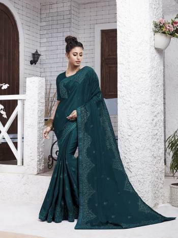 Enhance Your Personality Wearing This Designer Saree In Teal Blue Color. This Pretty Resham Embroidered Saree Is Fabricated On Chiffon Paired With Art Silk Fabricated Blouse. It Is Highlited With Pretty Stone Work Which Gives An Attractive Yet Elegant Look. 