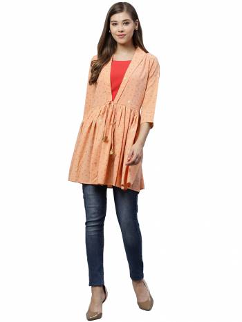 Grab This Pretty Readymade Top In Peach Color Fabricated On Crepe. Pair This Up With Black Or Blue Colored Denim. Buy This Top Now.