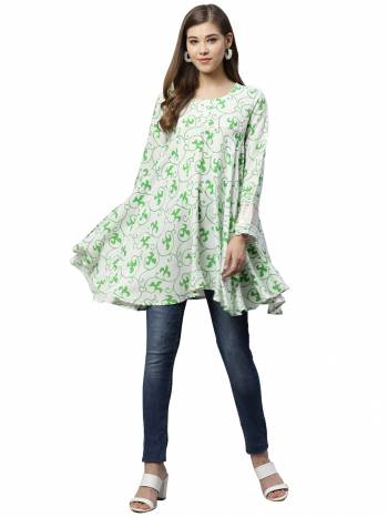 Grab This Pretty Readymade Top In White & Green Color Fabricated On Rayon. Pair This Up With Black Or Blue Colored Denim. Buy This Top Now.