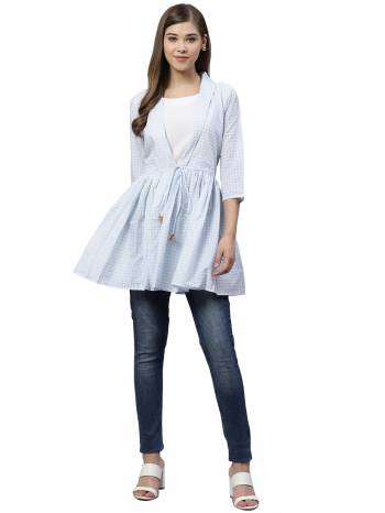 Grab This Pretty Readymade Top In White & Sky Blue Color Fabricated On Muslin. Pair This Up With Black Or Blue Colored Denim. Buy This Top Now.