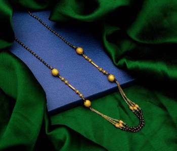 Here Is A Very Pretty Simple And Elegant Looking Mangalsutra In Gold And Black. This New And Unique Patterned Magalsutra Can Be Paired With An Kinf Of Attire And It Will Definitely Earn You Lots Of Compliments From Onlookers. 