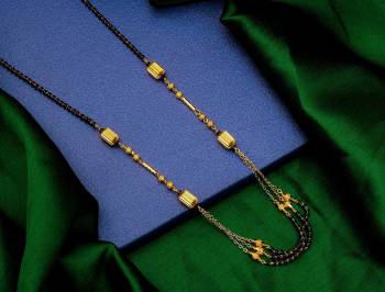 Here Is A Very Pretty Simple And Elegant Looking Mangalsutra In Gold And Black. This New And Unique Patterned Magalsutra Can Be Paired With An Kinf Of Attire And It Will Definitely Earn You Lots Of Compliments From Onlookers. 