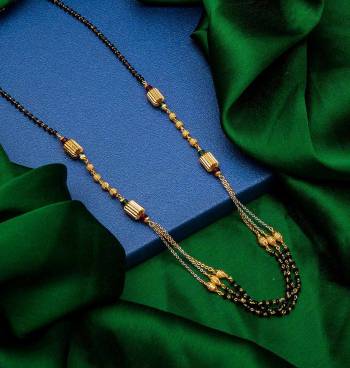 Here Is A Very Pretty Simple And Elegant Looking Mangalsutra In Gold And Black. This New And Unique Patterned Magalsutra Can Be Paired With An Kinf Of Attire And It Will Definitely Earn You Lots Of Compliments From Onlookers. 