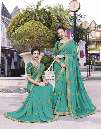 Grab This Pretty Attractive Saree In Turquoise Blue Color. This Saree Is Fabricated On Art Silk Paired With Jacquard Silk Fabricated Blouse. It Has Attractive Jari Embroidered Motifs With Detailed Weaved Broad Border. Its Rich Fabric And Color Will Earn You Lots Of Compliments From Onlookers.