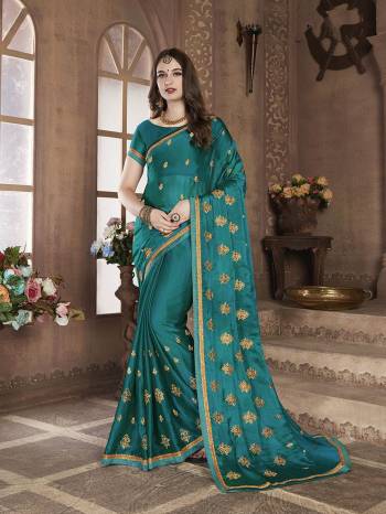 Look Pretty In This Elegant Butti Embroidered Designer Saree In Blue Color. This Pretty Saree Is Fabricated On Satin Chiffon Beautified With Jari Embroidered Pretty Motifs All Over. It Is Light Weight, Durable And Easy To Carry All Day Long. 