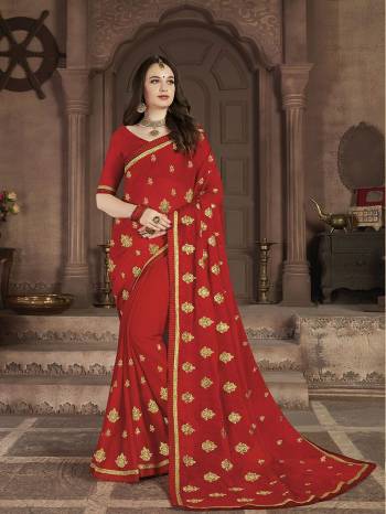 Celebrate This Festive Season With Beauty and Comfort In This Lovely Designer Saree In Red color. This Saree And Blouse Are Satin Chiffon Based Beautified With Jari Embroidered Motifs. 