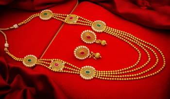 Give An Enhanced Look To Your Personality By Pairing Up This Beautiful Necklace Set With Your Ethnic Attire. This Pretty Set Is In Golden Color Beautified With Stone And Pearl Work. Buy Now