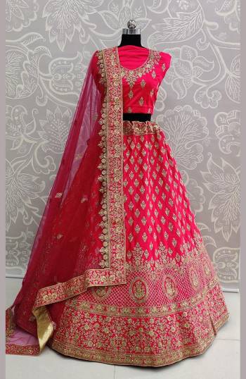 Catch All The Limelight At The Next Wedding You Attend Wearing This Heavy Designer Lehenga Choli In All Over Rani Pink Color. This Lehenga Choli Is Satin Silk Based Paired With Net Fabricated Dupatta.