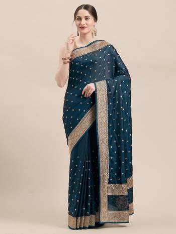 Flaunt Your Rich And Elegant Taste Wearing This Designer Saree In Blue Color Paired with Blue Colored Blouse. This Detailed Embroidered Saree And Blouse Are Satin Silk Based Which Also Gives A Rich Look To Your Personality. 